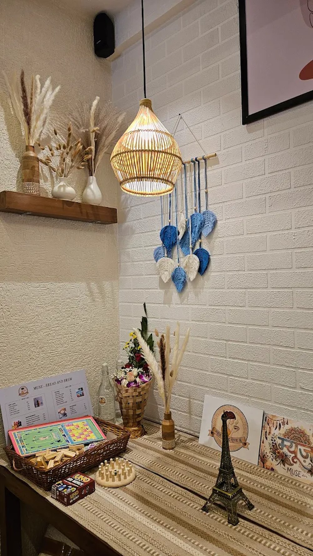 Rattan pendant light and macramé leaf hanging at Muse